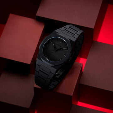 Ρολόι D1 Milano D1-PCBJ10 με μαύρο μπρασελέ και μαύρο καντράν σε οκτάγωνο σχήμα διαμέτρου 40.5 mm.